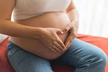 woman touching her belly