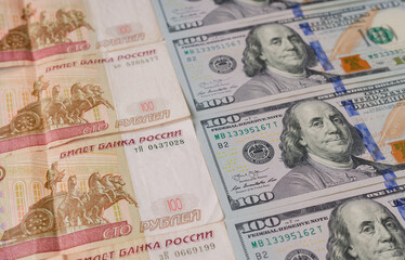 US Dollar and Russian rubles. Money background. Currency exhange. Economic crisis. Rouble dollar cash. Hundred dollar bills and 100 rubles. Business and finance. Russia and USA