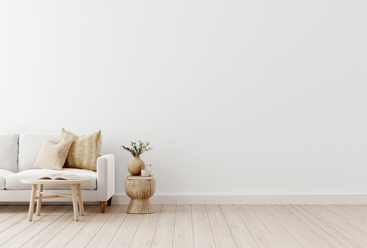 Empty wall mockup with sofa and beige pillows on empty white living room interior background. 3D rendering, illustration.