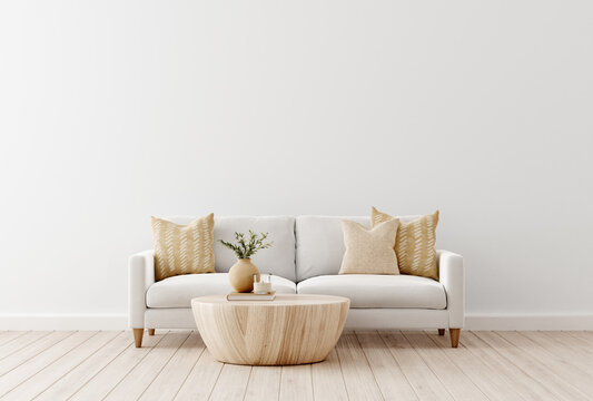 Interior wall mockup with sofa and beige pillows on empty white living room background. 3D rendering, illustration.