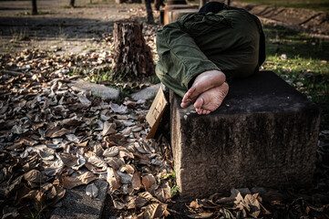 Asian man is homeless at the side road,A stranger has to live on the road alone because he has no family.