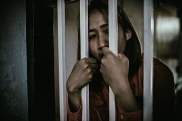 Hands of women desperate to catch the iron prison,prisoner concept,thailand people,Hope to be...