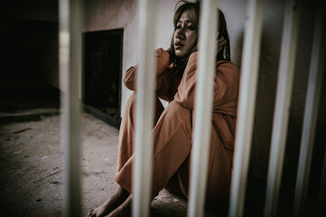 Hands of women desperate to catch the iron prison,prisoner concept,thailand people,Hope to be free,If the violate the law would be arrested and jailed.