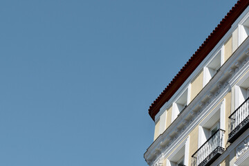 Corner of classical vintage building downtown Madrid, Spain. Spanish architectural style