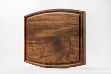 Cutting board with round parts and shadow on a white background