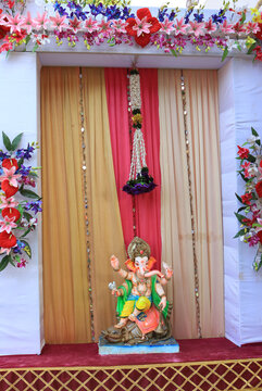 God Ganesh place in the decorative rectangle.