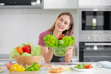 Asian women cooking salad vegetable organic eat healthy  at kitchen home