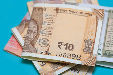 Indian rupee notes on blue background