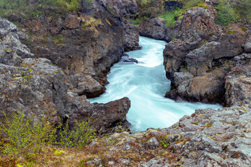 Lava rock formations at Barnafossar water falls in rural Iceland