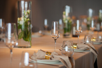 served table, glasses, plates, vase with forge