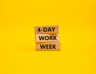 4-day work week symbol. Concept words 4-day work week on wooden blocks. Beautiful yellow background. Business and 4-day work week concept. Copy space
