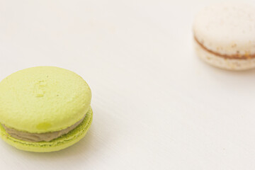 Macaroons. Green and white macarons on white background. Copy space