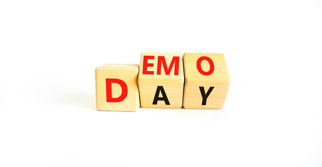 Demo day symbol. Concept words Demo day on wooden cubes. Beautiful white table white background....