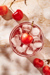 refreshing lemonade with ice and cherries