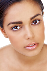 Fototapeta premium Her natural beauty is captivating. A beautiful young woman isolated on white.