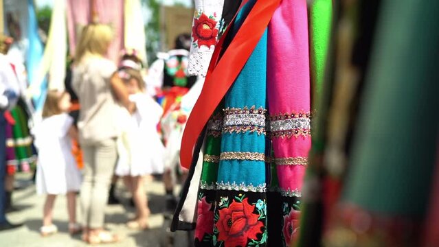 Łowicz Corpus Christi celebration. Focus on traditional striped skirt. Slow motion video. Polish folklore