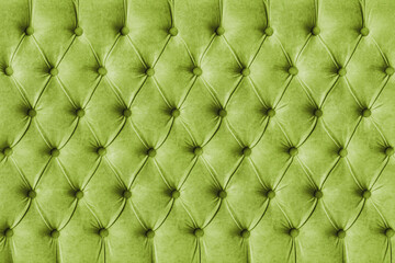 Green olive capitone checkered soft fabric textile decorative background with buttons. Classic retro Chesterfield style, luxurious upholstery buttoned texture for furniture, wall, headboard, sofa, cou