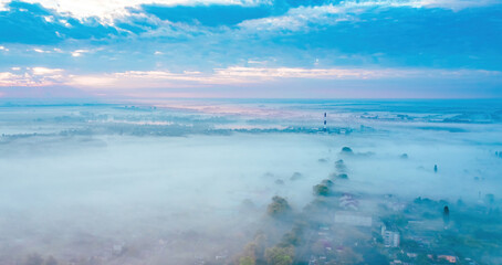 Morning fog, Ukrainian village covered with fog, drone view, aerial photography