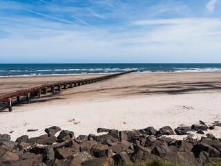 Cambois beach in Northumberland, UK with rocks to prevent erosion by the sea.