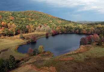 Fototapeta na wymiar Aerial view of a lake and mountain in autumn