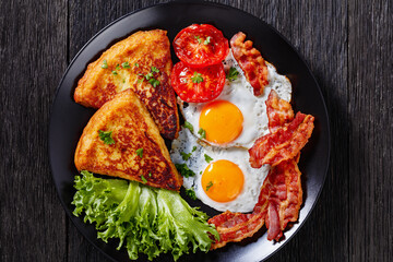 irish breakfast of fried eggs, bacon, potato farls