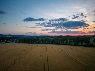Aerial shot of sunset over field