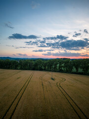 Aerial shot of sunset over field