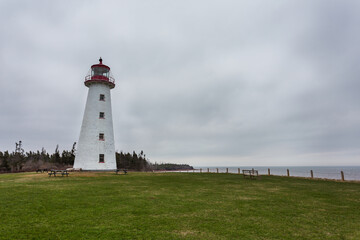 Fototapeta na wymiar Point Prim Light house, Northumberland Strait, Belfast, Prince Edward Islands. Built in 1845, a National Heritage site, is the first and oldest lighthouse in PEI, Canada