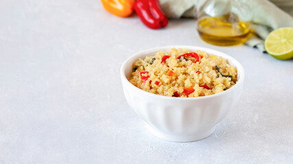 Bowl of quinoa cooked with bell peppers
