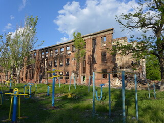 Fototapeta na wymiar Mariupol, Ukraine. Ruins of the School. This building survived in the WWII, but destroyed by Russian army. 