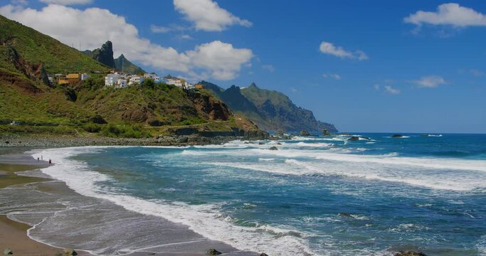 Rocky coast, mountain coastline in the north of Tenerife. Almaciga beach with cute colourful village, Canaries. Spain. Roque de las Animas.
