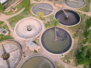 Wastewater treatment plant with round ponds for recycle dirty sewage water, aerial view