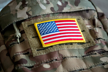 USA flag on army camo equipment - obrazy, fototapety, plakaty