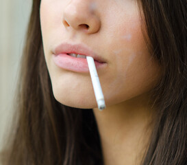 Young woman smoking cigarette