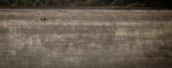 Boat on the lake in a Misty morning 