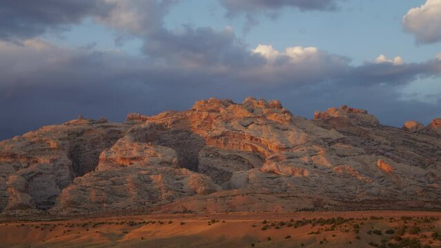Clouds moving over deep canyons of Split Mountain in the Utah desert at Dinosaur National Monument.