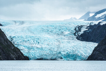Holgate Glacier, found in Holgate Arm in Aialik Bay, within Kenai Fjords National Park, is a tidewater and mountain glacier.