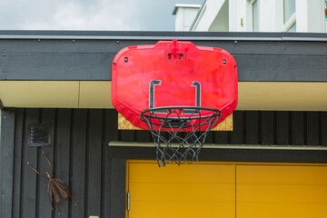 Close up view of basketball hoop with net mounted on wooden wall. Sweden. 