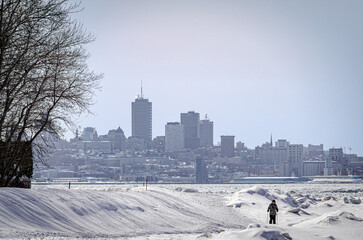 Quebec city skyline from the Island of Orleans, in winter, with the frozen St Lawrence River, Quebec City, Canada