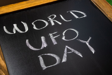 World Ufo Day on a blackboard