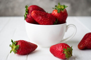 strawberries in a white cup