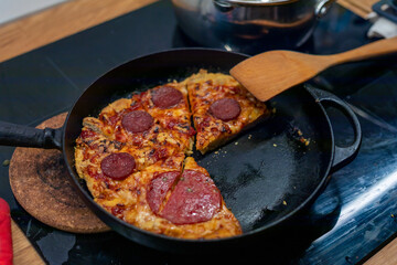 Homemade Pepperoni salami pizza in a metal pan