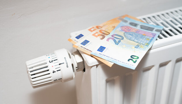 Energiepreise Heizkosten Heizung mit Geldscheinen Euro im Haushalt