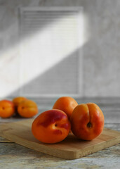 Fresh ripe apricots on a wooden background, copy space. Apricots are rich in vitamins and minerals such as: vitamin A, beta-carotene, vitamin C, potassium, silicon, cobalt, manganese, copper