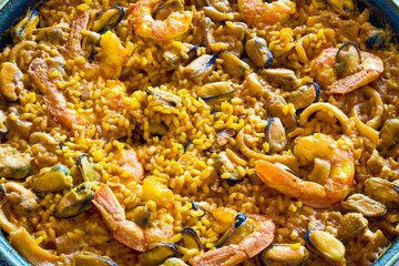 Close-up of a seafood paella. Typical Spanish food. Selective focus.