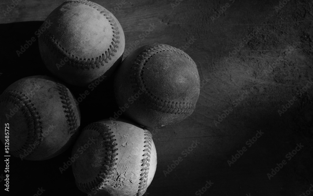 Wall mural dark moody lighting with selective focus on baseball balls for sports competition background. - Wall murals