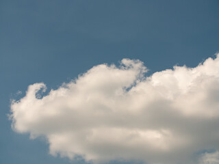 Blue sky with white clouds in the summer. White cirrus and cumulus clouds. Place in the center is  perfect to add text.