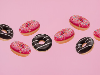 Design template with flying doughnuts. Mixed frosted sprinkled donuts on pink backdrop
