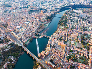 Fototapeta premium Aerial view of French city of Albi on bank of Tarn river in autumn day