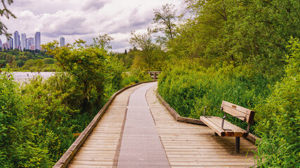 Boardwalk bordering Deer Park Lake, Burnaby, BC.